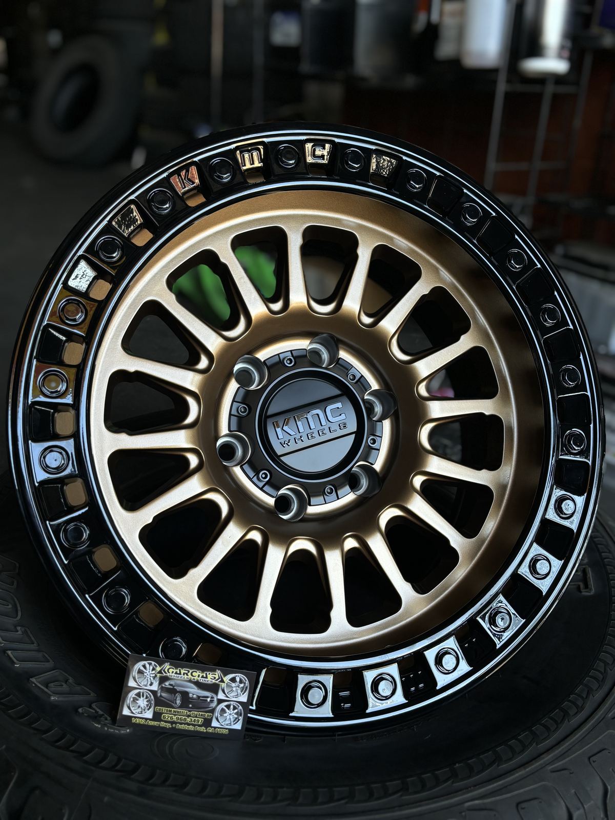 Bronze KMC off-road wheel with beadlock-style ring